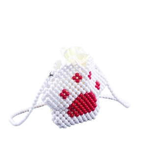 Handmade white beaded mini crossbody bag featuring a red heart pattern and satin drawstring