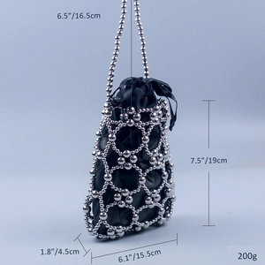 Detail view of silver beaded handbag with dimensions and drawstring satin liner