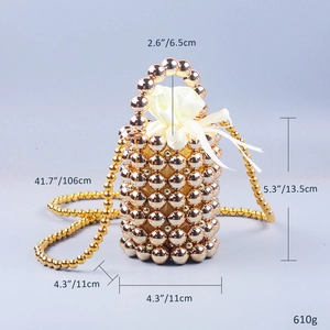 Detailed dimensions of gold pearl bead handbag showing 13.5cm height and 610g weight