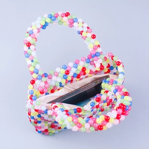 Handmade colorful beaded heart-shaped handbag with rainbow beads and zipper closure