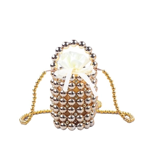 Handmade gold beaded bucket bag with drawstring satin lining and top handle