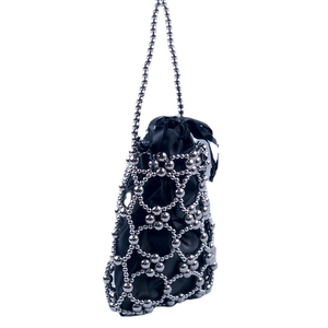 Silver bead mesh handbag with black satin drawstring lining and round bead handle