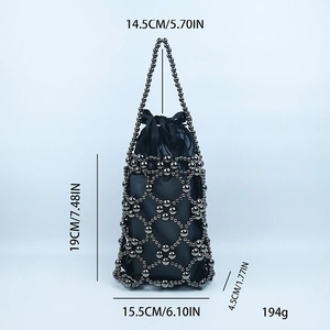 Detail of handmade beaded handbag with dimensions 19x15.5cm and grey metallic beads