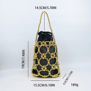 Detail view of gold beaded handbag with black satin drawstring lining and size markings