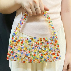 Detail view of a handmade rainbow acrylic beaded tote bag with vibrant translucent beads