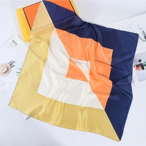 Minimalist square silk scarf with geometric patchwork design in navy and orange colors