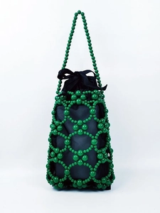 Handmade green beaded handbag with hollow geometric weave and black drawstring lining