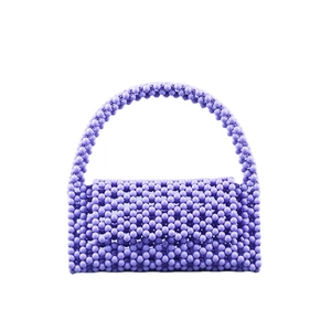 Handmade light purple beaded shoulder bag with round acrylic pearls and woven flap design