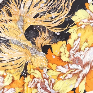 Silk square scarf featuring golden koi fish and peony floral patterns on black fabric