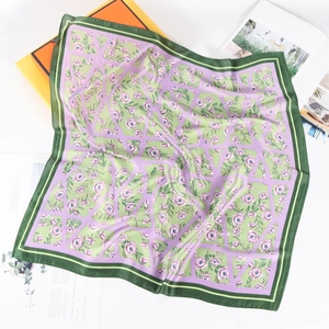 Elegant floral print square silk scarf with purple and green contrast border on white background