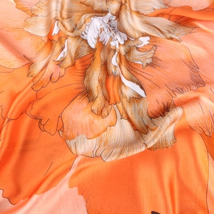 Macro shot of 70cm silk scarf featuring elegant peony floral prints and satin texture