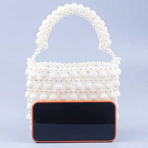 Handmade cream white beaded pearl handbag with textured beads and woven handles