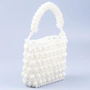Elegant white beaded pearl woven handbag with a sophisticated French baroque vintage style
