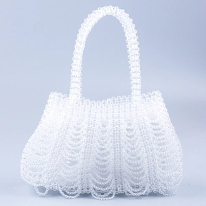 Handmade clear beaded handbag with unique wave texture and semi-circular top handle