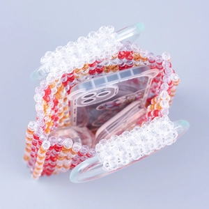 Handmade red and orange beaded handbag with transparent ring handles and open interior