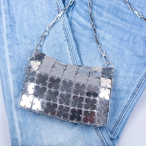 Close-up of handmade square silver sequin mesh bag with metallic chain strap