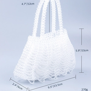 Macro shot showing wavy woven bead texture and dimensions of the white acrylic handbag