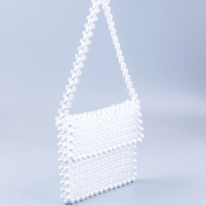 Handmade white and clear acrylic beaded crossbody bag with woven flap and strap