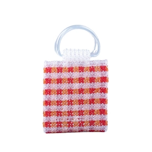Handmade beaded handbag with red orange stripes and round acrylic handles for summer