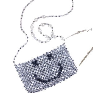 Silver woven beaded crossbody bag with smile face pattern and pearl strap
