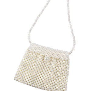 Handmade pearl beaded crossbody dumpling bag with elegant top handle and flap closure