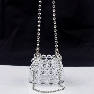 Handmade transparent beaded mini bag with silver metal ball handle and chain strap