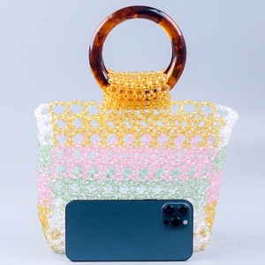 Handmade beaded tote bag with colorful resin beads and brown round handles for summer