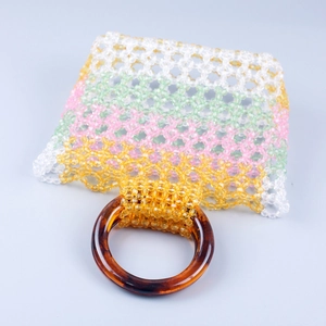 Colorful handmade beaded bag with retro stripes and resin ring handle in 45-degree view