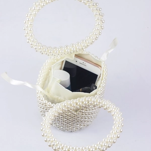 Top view of handmade pearl bucket bag showing internal capacity with drawstring liner