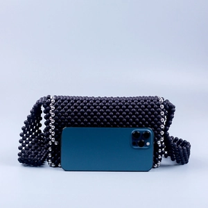 Handmade beaded crossbody bag with matte black acrylic and silver beads, rectangular flap