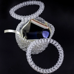 Handmade clear beaded bucket bag with round handles and white inner pouch for women