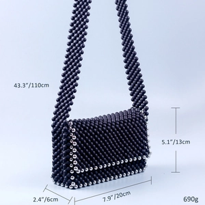 Detail view of handmade beaded messenger bag with precise size and weight specifications