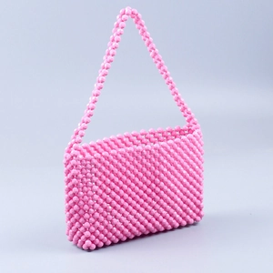 Pink handmade acrylic beaded handbag with woven strap and sweet dopamine style aesthetics
