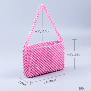 Detailed dimensions of pink acrylic beaded handmade handbag with shoulder strap and weight
