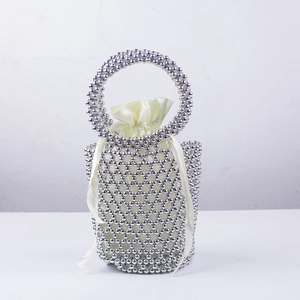 Elegant silver beaded bucket bag with white satin drawstring liner and round handle