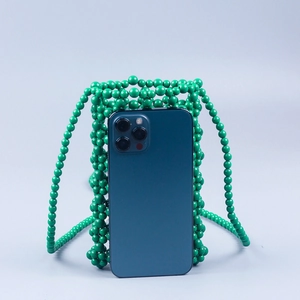 Handmade emerald green beaded crossbody phone bag with woven grid pattern and long strap