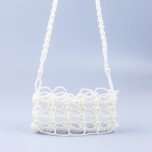 Handmade pearl woven crossbody bag with hollow lattice design and elegant strap