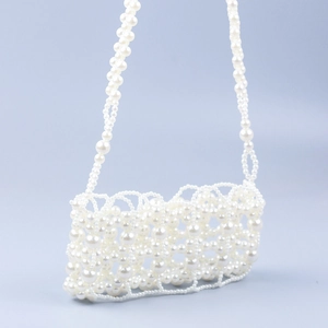 Handmade pearl beaded hollow woven crossbody bag with vintage French style elegance