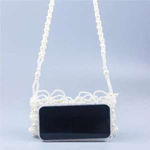 Handmade pearl woven mini crossbody bag in white with crossbody strap and phone size scale