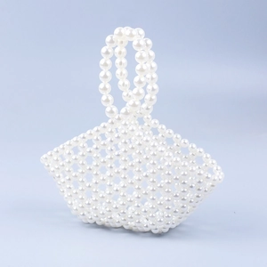 Elegant handcrafted small pearl beaded hollow basket handbag for women