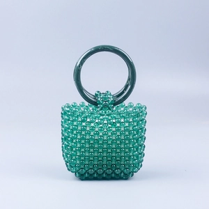 Summer green acrylic beaded handbag with round marble patterned handles and woven texture