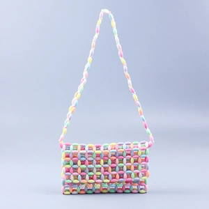 Detail of colorful acrylic bead weaving on a sweet handmade crossbody shoulder bag