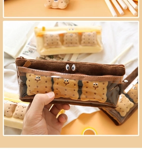 Detail of plush biscuit pencil case featuring PVC window and 3D cookie decorations