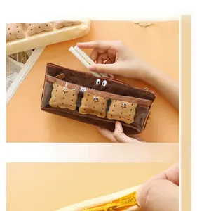 Detail of creative plush cookie pencil case with PVC window and cute biscuit charms