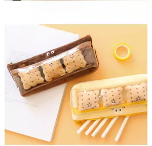 Detail of plush biscuit pencil case with clear window and cute embroidered face