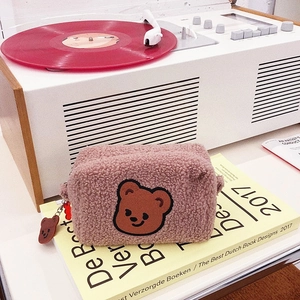 Cute cherry bear pink fleece makeup bag with cartoon zipper charm on a vintage player