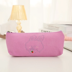 Detail of lavender canvas pencil case featuring embroidered cartoon bunny and zipper closure