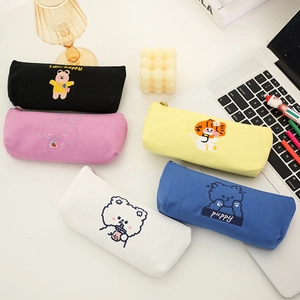 Cute embroidered animal canvas pencil cases in five colors on a desk for school students