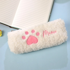 Close-up of white plush pencil case with pink cat paw embroidery and Meow detail
