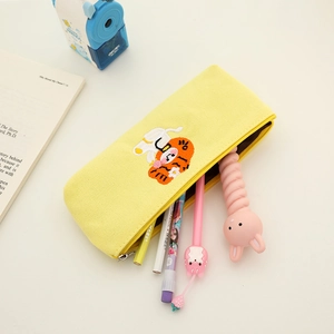 Close-up of cute cartoon cat embroidery on bright yellow canvas pencil case with zipper